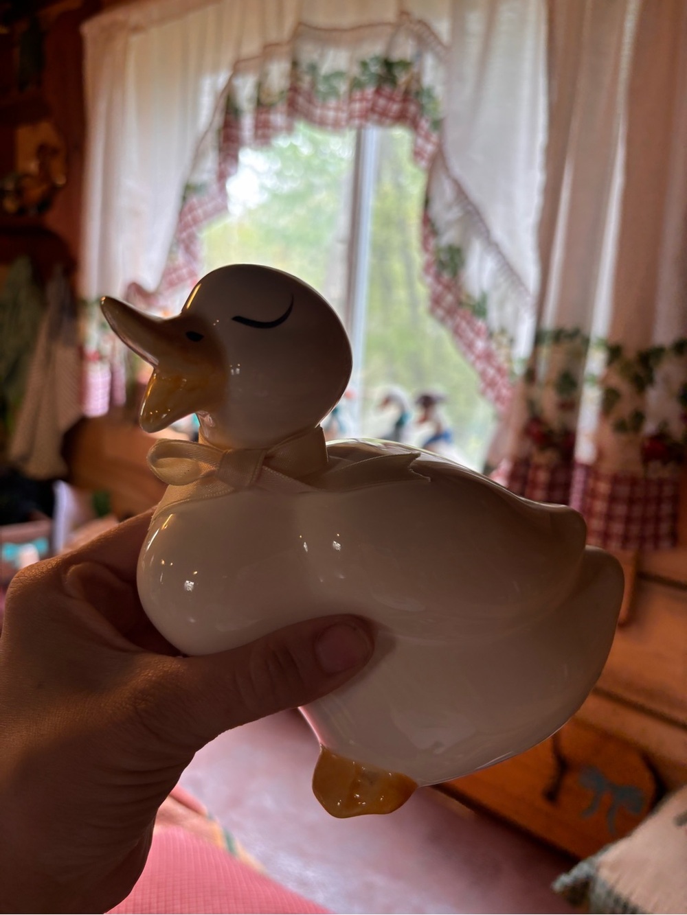 White Ceramic Duck Figurine with Yellow Beak and Feet